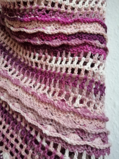 A close-up of the lace pattern and shades of white, pink and dark mauve used in our hand crocheted 'Antique Rose Crochet Shawl'.