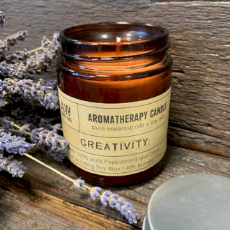 This natural, soy, organic, wax candle is called 'Creativity' and is peppermint and clove scented. In a bronze glass jar it fits any location and lasts up to 40 hours burn time.