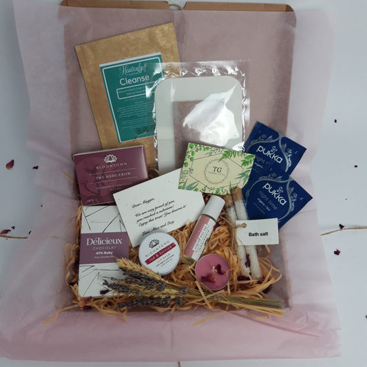 'Exquisite Luxuries' is a spa treat letterbox full of organic products including soap bar, handmade chocolates, lip balm, face masks, night teas, bath salts, candle and infuser oil.