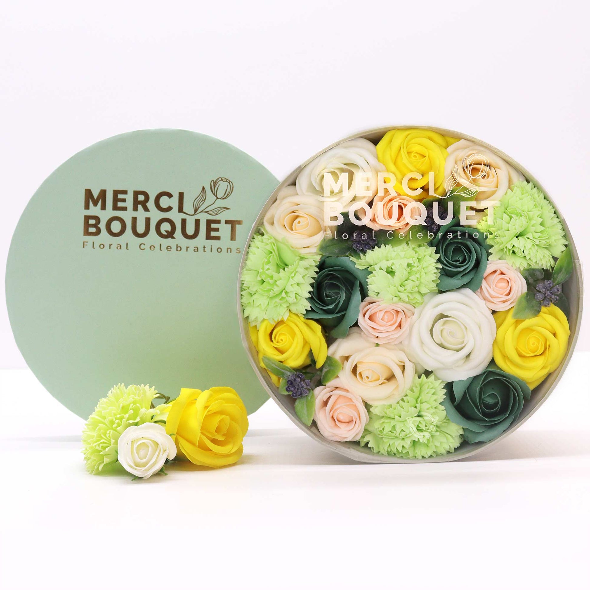 In a green hatbox named Merci Bouquet Floral Celebrations, this Soap Hat Box is full of Spring colours such as yellows, pinks, whites and greens. A scented gift perfect for a home spa experience.
