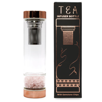 A full side view of our glass Infuser Bottle for Tea, at the bottom is one of the variety of gem stones on offer which help purify and heal.